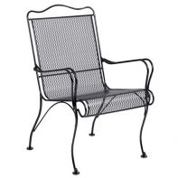 Woodard Tucson Commercial High-Back Dining Armchair featuring timeless curved ironwork and a mesh seat for a professional commercial setting.