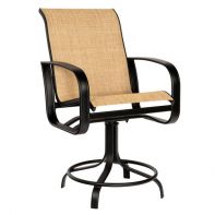Woodard Cayman Isle Sling Commercial Swivel Counter Stool featuring a sleek silhouette and lightweight aluminum frame for a professional commercial setting.