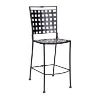 Woodard Sheffield Commercial Stationary Armless Bar Stool featuring a squared lattice back and wrought iron frame for a professional commercial setting.