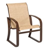 Woodard Cayman Isle Commercial Sling Dining Armchair featuring a sleek silhouette and lightweight aluminum frame for a professional commercial setting.