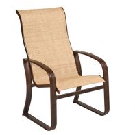 Woodard Cayman Isle Commercial High Back Dining Armchair featuring a sleek silhouette and lightweight aluminum frame for a professional commercial setting.