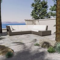Modern POLYWOOD Elevate Corner Sectional with white quick-dry cushions on a luxury outdoor stone patio overlooking the ocean.
